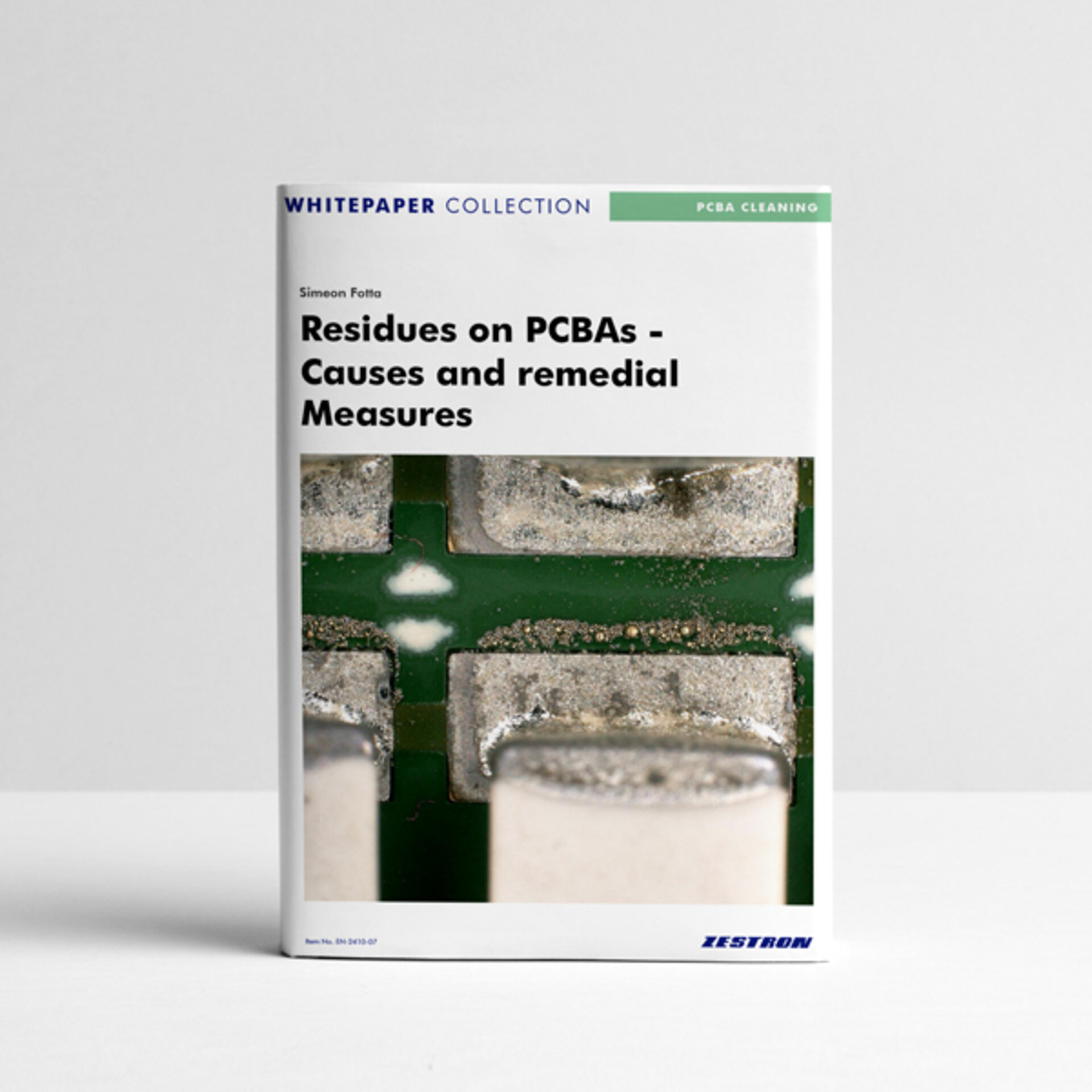 The picture shows a white paper that deals with the causes and remedial measures for residues on electronic assemblies. | © @ZESTRON